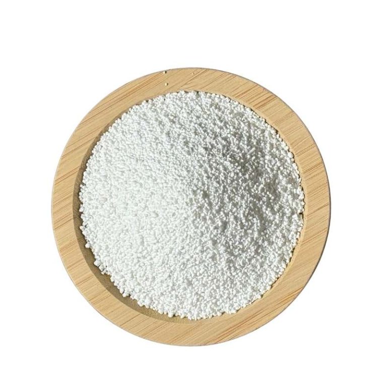 Calcium butyrate granules on a wooden dish